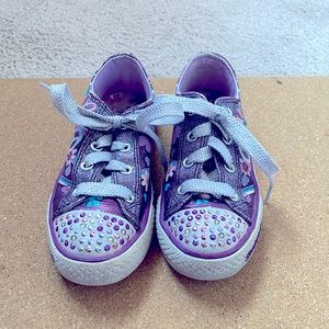 Sketchers Twinkle Toes light up purple shoes with designs. US size 11.5.